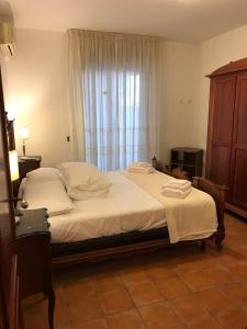 Postel nebo postele na pokoji v ubytování Villetta della Nonna Mondello