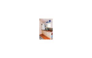 a view of a kitchen from the living room at One-Bedroom Holiday Home In Ed in Fagerhult