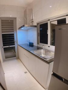 Kuchyň nebo kuchyňský kout v ubytování 駐駐逢甲 Shine Residence