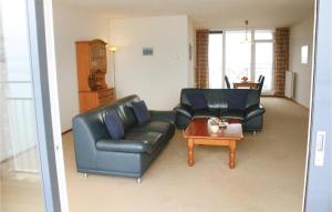 a living room with two leather couches and a coffee table at 1 Bedroom Amazing Apartment In Breskens in Breskens