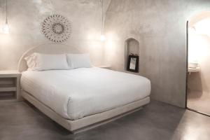 Voodi või voodid majutusasutuse Hotel Thireas toas