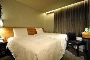Posteľ alebo postele v izbe v ubytovaní Forward Suites II