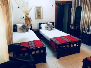 
A bed or beds in a room at Joseph Family Villa

