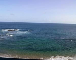 an aerial view of the ocean with a beach at Pier Sul Apartaments in Salvador