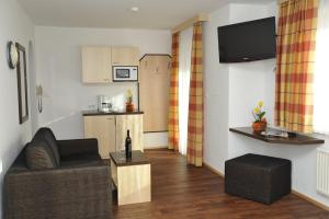 Kuchyň nebo kuchyňský kout v ubytování Hotel Alpina