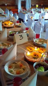 a table with many plates of food on it at ZAJAZD NA GRONICKU in Zwardoń