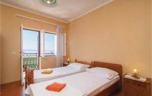 Postel nebo postele na pokoji v ubytování Apartment Jesenice Bajnice With Sea View Ix