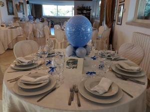 a table with a blue balloon sitting on top of it at Tenuta Di Pietra Porzia in Frascati