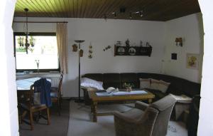 a living room with a couch and a table at Beautiful Home In Dautphetal With 2 Bedrooms in Holzhausen