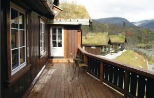 a balcony of a house with a white door at Stunning Home In Hemsedal With 4 Bedrooms, Sauna And Wifi in Hemsedal