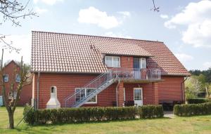a red brick house with a staircase on it at 2 Bedroom Pet Friendly Apartment In Mirow Ot Qualzow in Qualzow