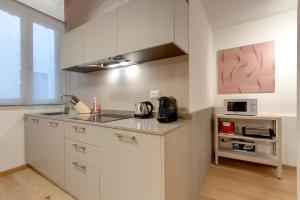 A kitchen or kitchenette at Borgo Apartment by Mamo Florence