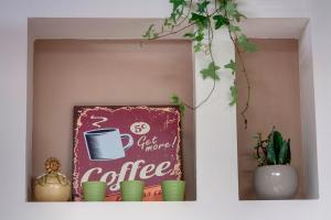 Coffee and tea making facilities at Borgo Apartment by Mamo Florence
