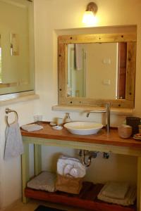 a bathroom with a sink and a mirror at B&B - Racheli Bar-Lev in Had Nes