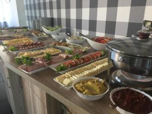 a buffet with many different types of food on a table at Prima in Krynica Morska
