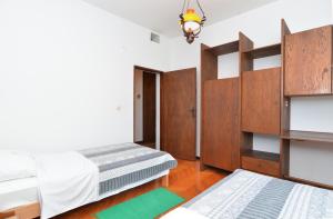 Łóżko lub łóżka w pokoju w obiekcie Apartment Milka 1950