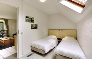 Tempat tidur dalam kamar di Gerner - 6 Pers Bungalow