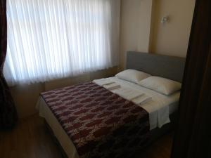 A bed or beds in a room at Hagia Sophia Apartment