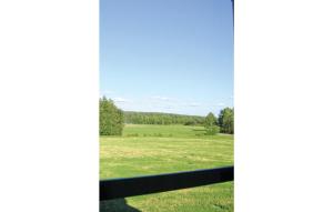 a view of a field from a fence at Holiday Home Ljungkullen Ramkvilla in Ramkvilla