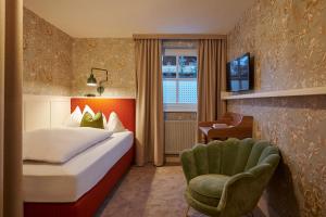 Postel nebo postele na pokoji v ubytování Boutique-Hotel Schmelzhof