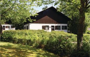 a white house with a black roof at Ferienhaus 13 In Thalfang in Thalfang