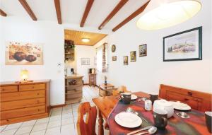 a dining room with a wooden table and chairs at Ferienhaus 13 In Thalfang in Thalfang