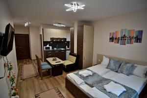 Postel nebo postele na pokoji v ubytování Madini apartment