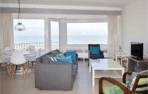 a living room with a couch and a table at Residentie Emeraude 4D in Ostend