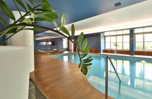 Bazén v ubytování Best Western Plus Hotel Le Favaglie nebo v jeho okolí