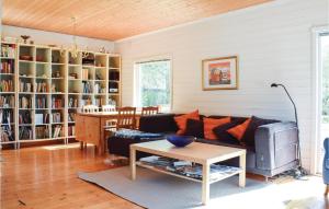 a living room with a couch and a table at Gorgeous Home In Eivindvik With Kitchen in Eivindvik
