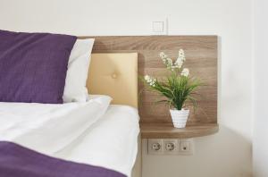 Postel nebo postele na pokoji v ubytování Coin Hotel