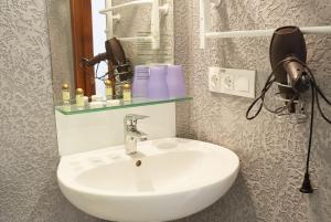 Koupelna v ubytování Coin Hotel