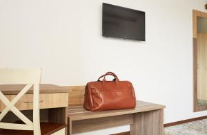 TV a/nebo společenská místnost v ubytování Coin Hotel
