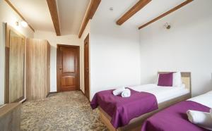 Postel nebo postele na pokoji v ubytování Coin Hotel