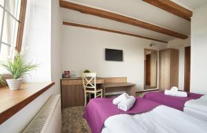 Postel nebo postele na pokoji v ubytování Coin Hotel