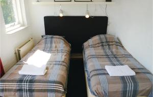 Postel nebo postele na pokoji v ubytování Two-Bedroom Holiday Home In Callantsoog