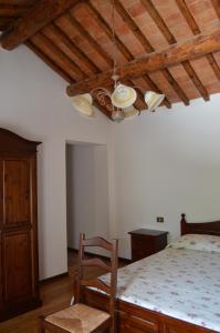 A bed or beds in a room at Colle Del Barbarossa