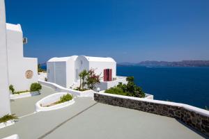 a view of the ocean from a white building at Santorini View in Akrotiri