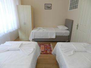 A bed or beds in a room at Hagia Sophia Apartment