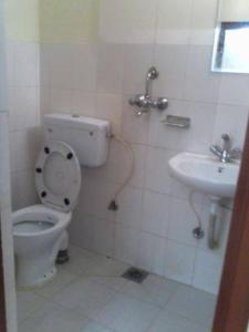 a bathroom with a toilet and a sink at Hotel Sisters Home in Kathmandu