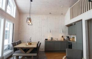 a kitchen with a wooden table and a dining room at Stunning Home In Lillehammer With 4 Bedrooms And Wifi in Lillehammer