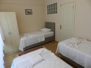 A bed or beds in a room at Hagia Sophia Apartment