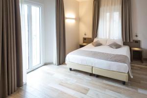 Postel nebo postele na pokoji v ubytování Hotel Baia di Paré