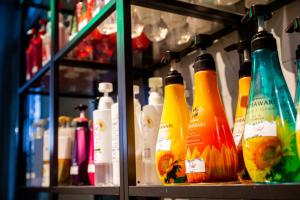 a shelf filled with lots of bottles of alcohol at Water Hotel Mw (Love Hotel) in Saitama