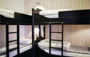 a group of bunk beds in a room at Nice Apartment In Hemsedal With Sauna in Hemsedal +3 photos