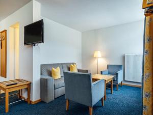 TV a/nebo společenská místnost v ubytování Hotel-Restaurant Bellevue