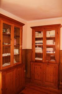 two wooden cabinets in a room at Sintra Small Hostel in Sintra