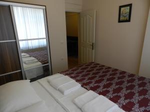 A bed or beds in a room at Hagia Sophia Apartment