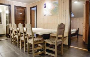 a dining room with a table and chairs at Nice Apartment In Hemsedal With Sauna in Hemsedal