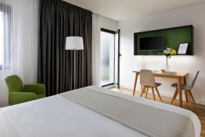 Postel nebo postele na pokoji v ubytování Citadines Austerlitz Paris